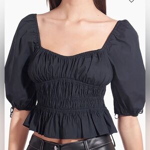 STAUD NWT Faye Black Cotton Top
Puff sleeve, shirred bodice and scoop neck.